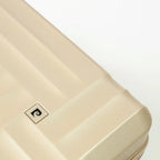 Beige suitcase with a brand logo on a white background