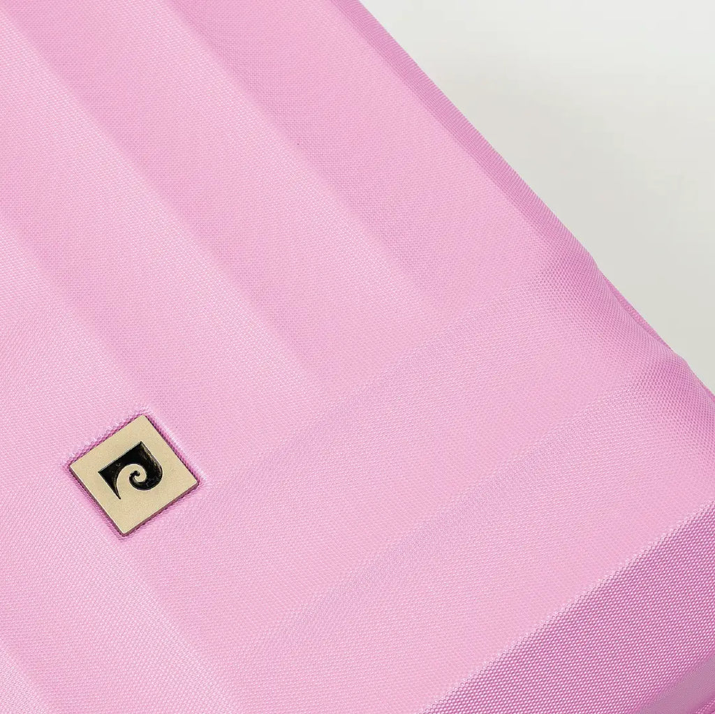 Close-up of a pink fabric with a brand logo on a white background