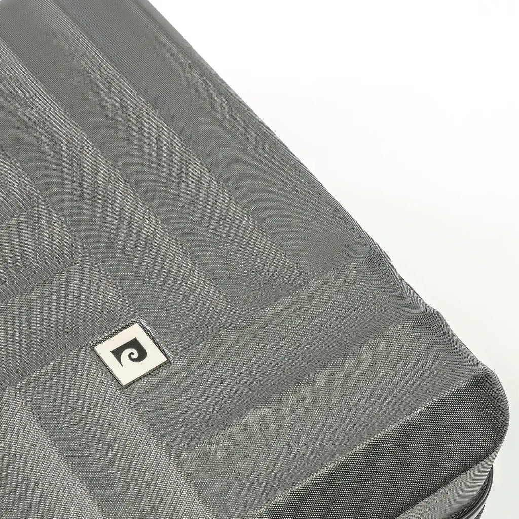 Gray textured suitcase with a brand logo on a white background