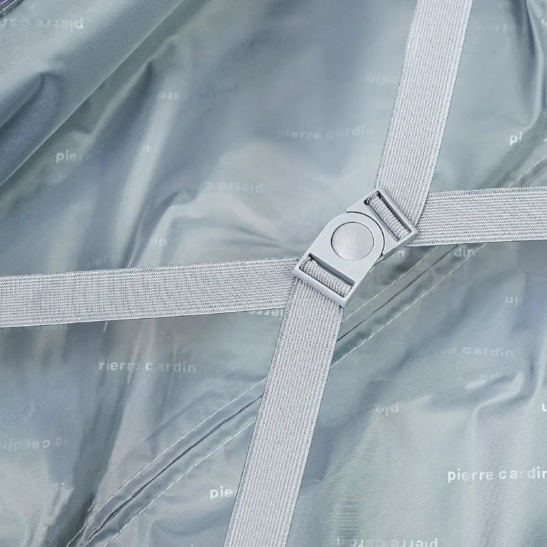 Close-up of straps on a grey fabric background with 'Pierre Cardin' branding.