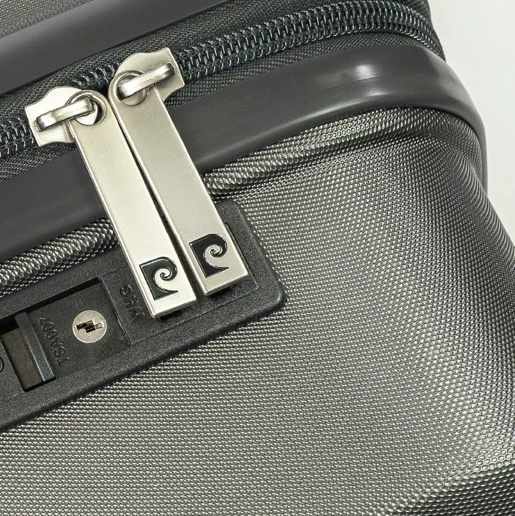 Close-up of a silver lock on a gray suitcase