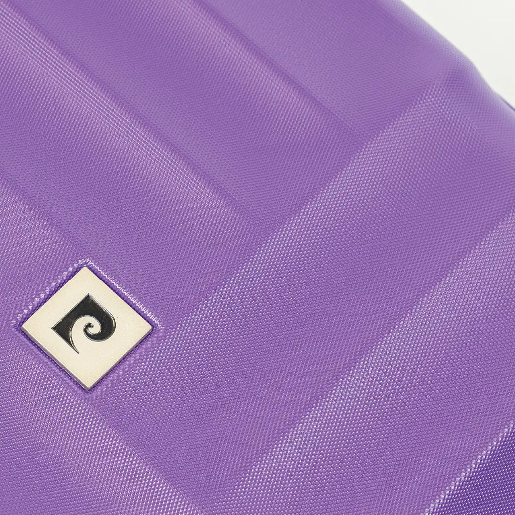 Close-up of a purple textured surface with a logo in the corner.