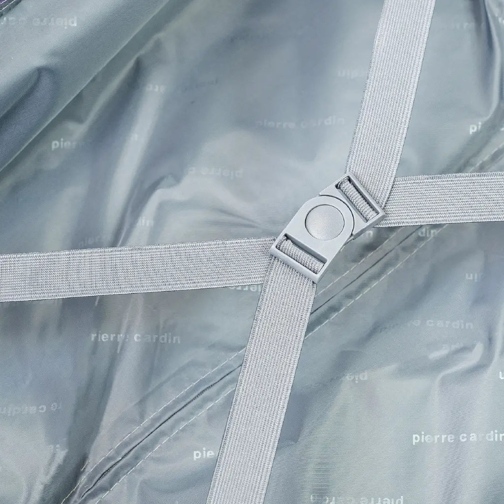 Close-up of a gray fabric with a metal clip on a gray background