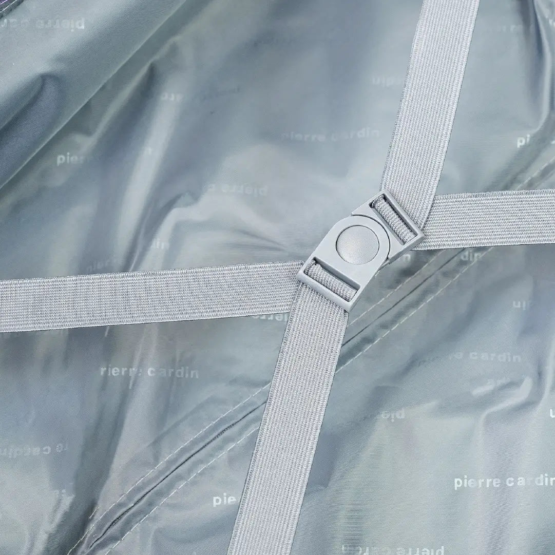 Close-up of a gray fabric with a metal clip on a gray background