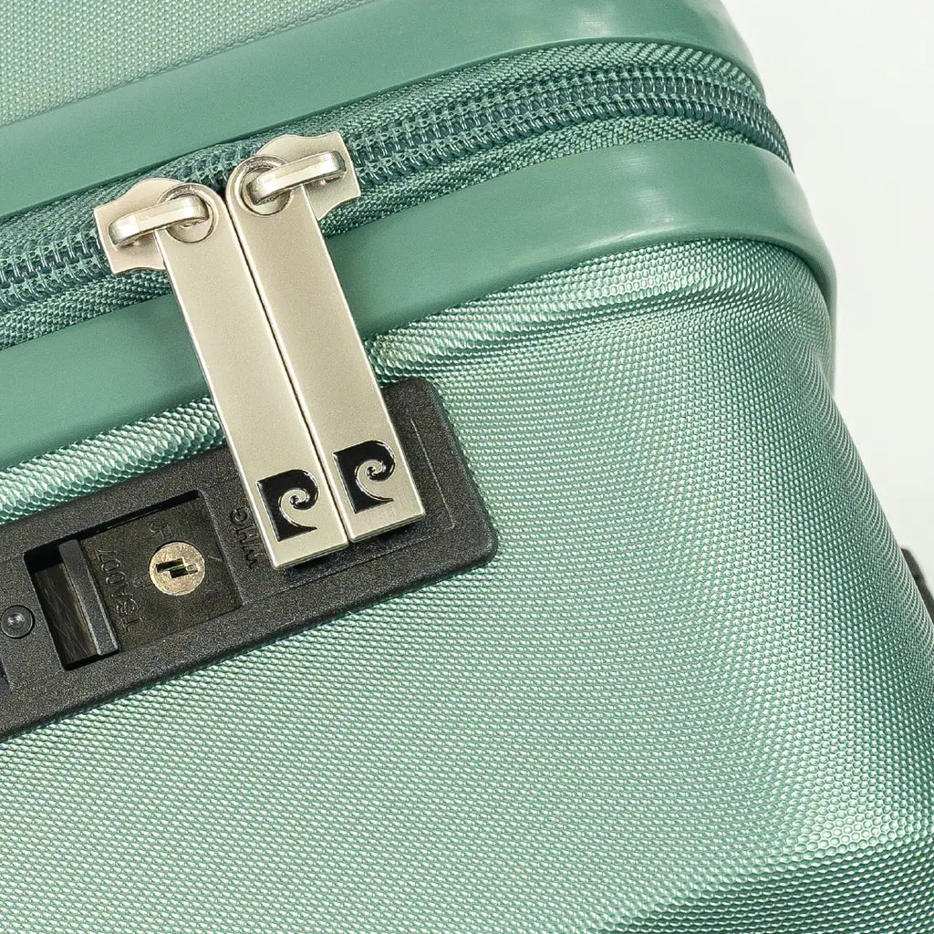 Close-up of a green suitcase with a zipper and lock mechanism.