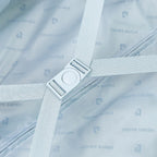 Suticase interior with a strap, buckle and brand logo