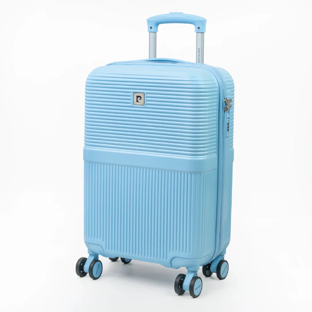 Light blue suitcase with a visible brand logo on a white background