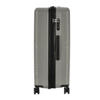 Silver suitcase with black handle and wheels on a white background