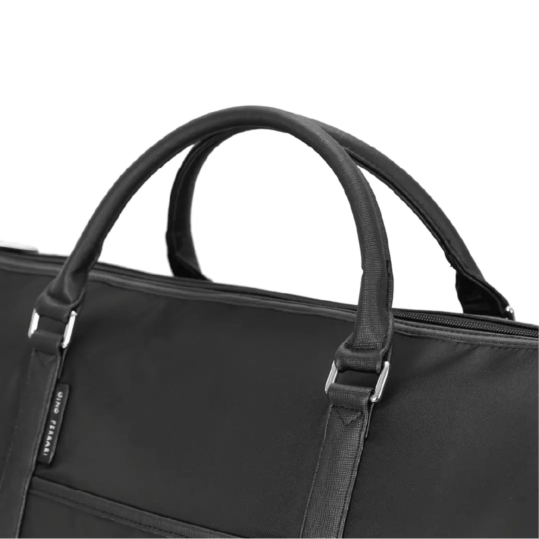 Black duffel bag with handles and a visible brand logo on a white background