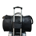 Black duffel bag on a suitcase on a white background