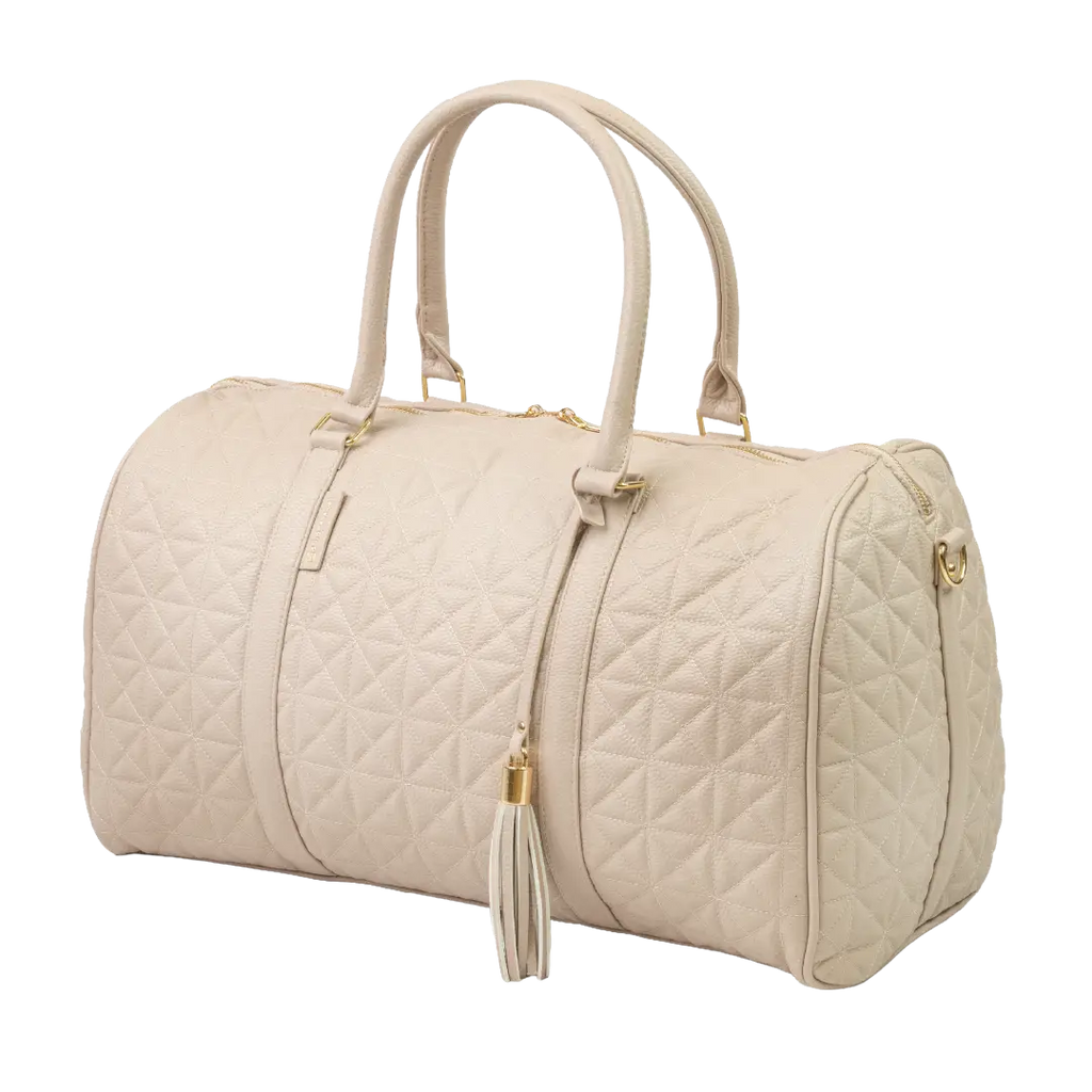 A close-up of a beige bag with patterned stitching, a gold zip and gold accents.