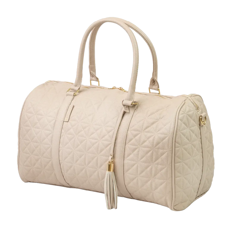 A close-up of a beige bag with patterned stitching, a gold zip and gold accents.