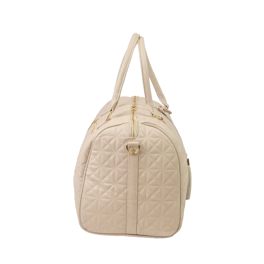 A close-up of a beige bag with patterned stitching, a gold zip and gold accents.