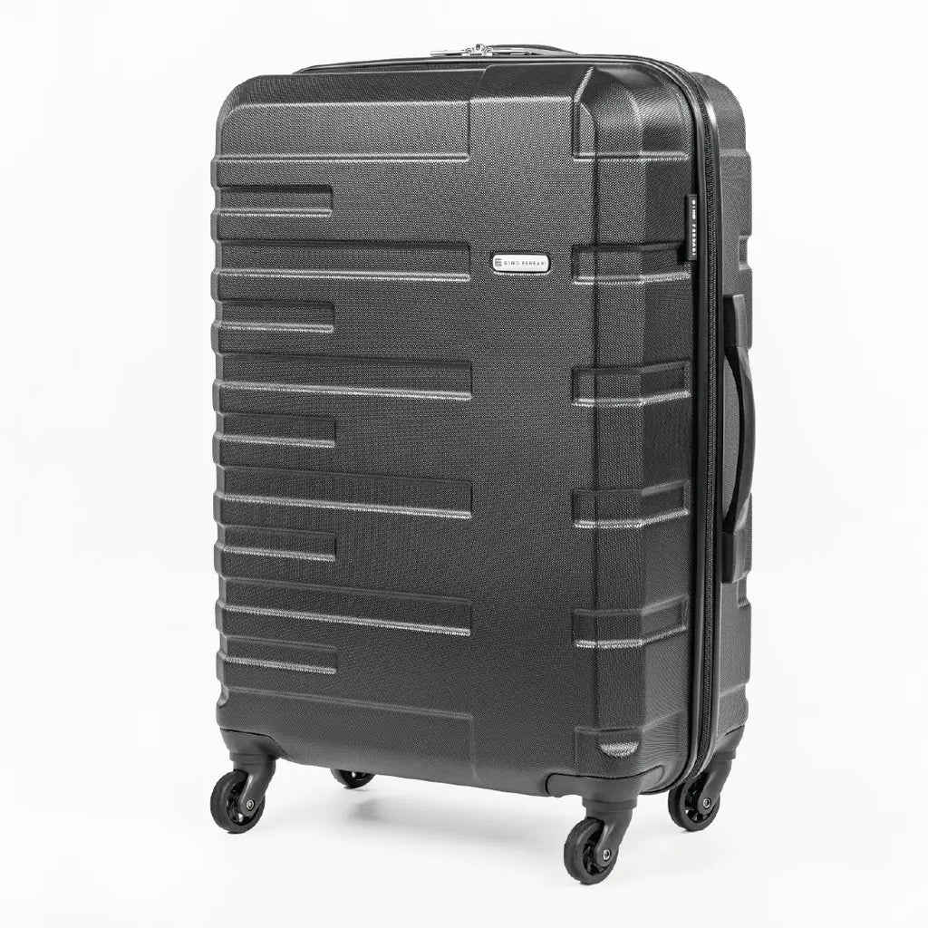 Black suitcase with a textured surface on a white background
