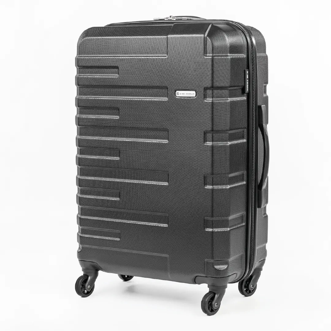 Black suitcase with a textured surface on a white background