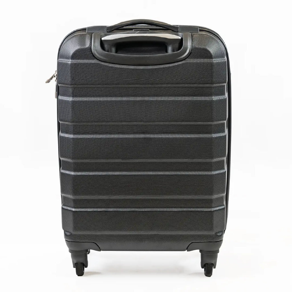 The back of a black cabin-sized suitcase.