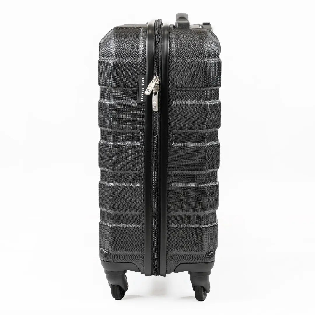 Side-view of a black cabin-sized suitcase, including the zips.
