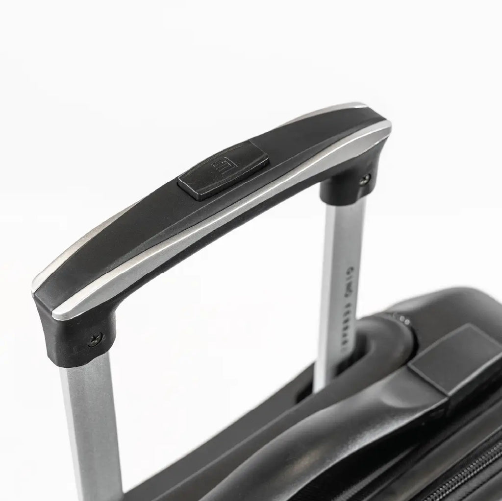 A handle of a black suitcase.
