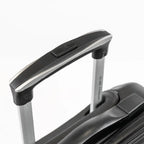A handle of a black suitcase.