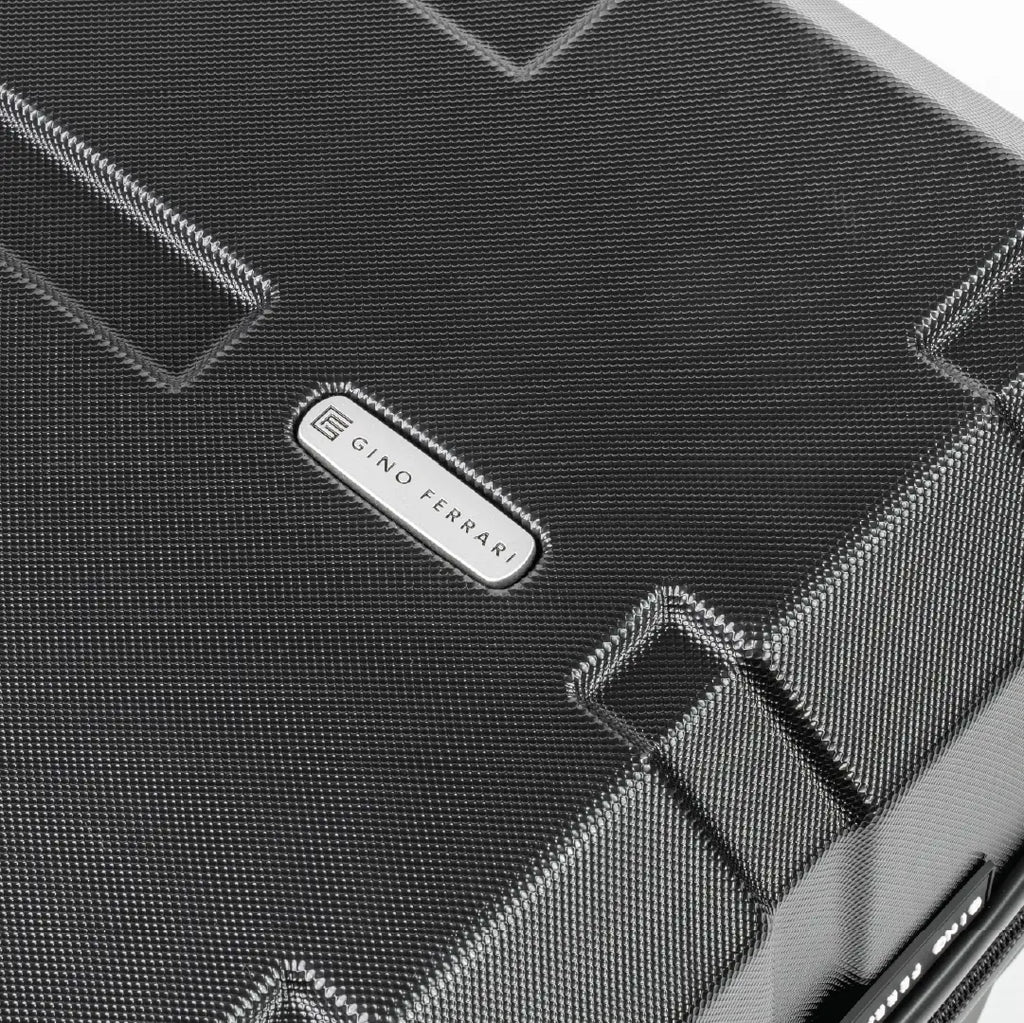 Close-up of a black suitcase showcasing the logo.
