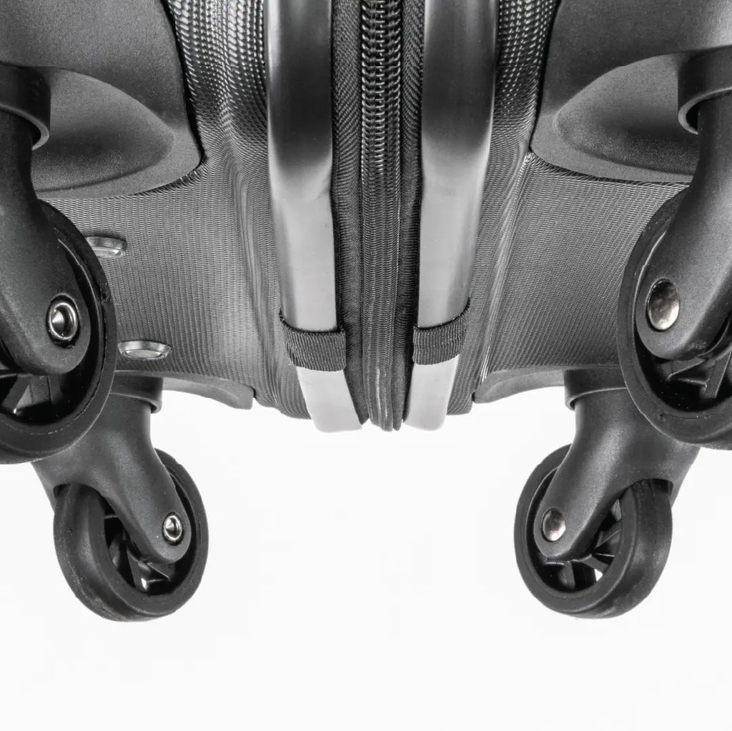 Close-up of the bottom of a black suitcase showing the wheels.