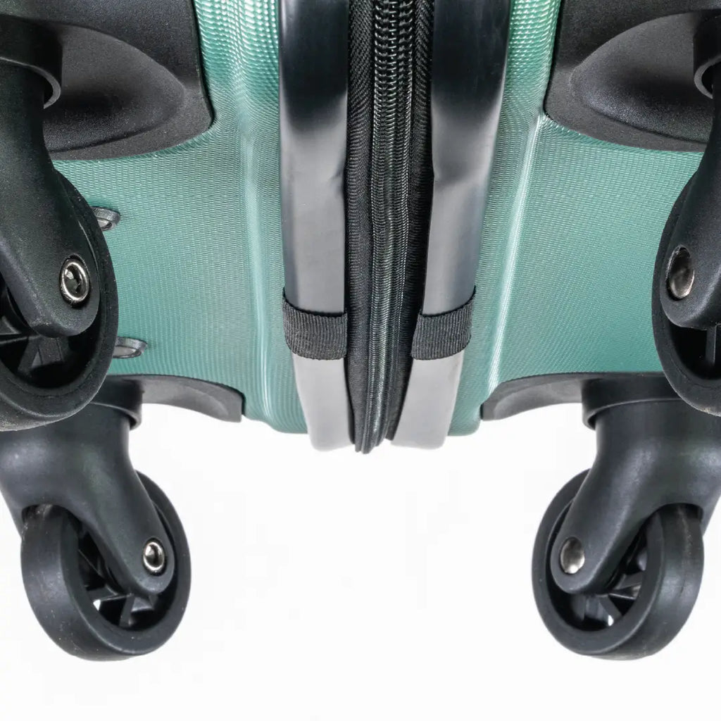 Close-up of a teal suitcase with wheels and zipper.