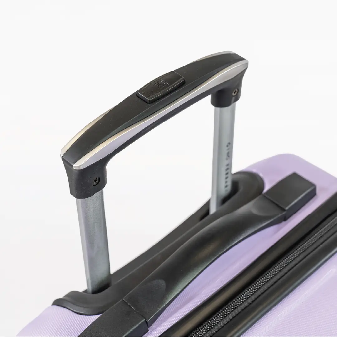 Close-up of a suitcase handle on a white background