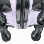 Close-up of a hard shell suitcase with wheels and zippers on a white background