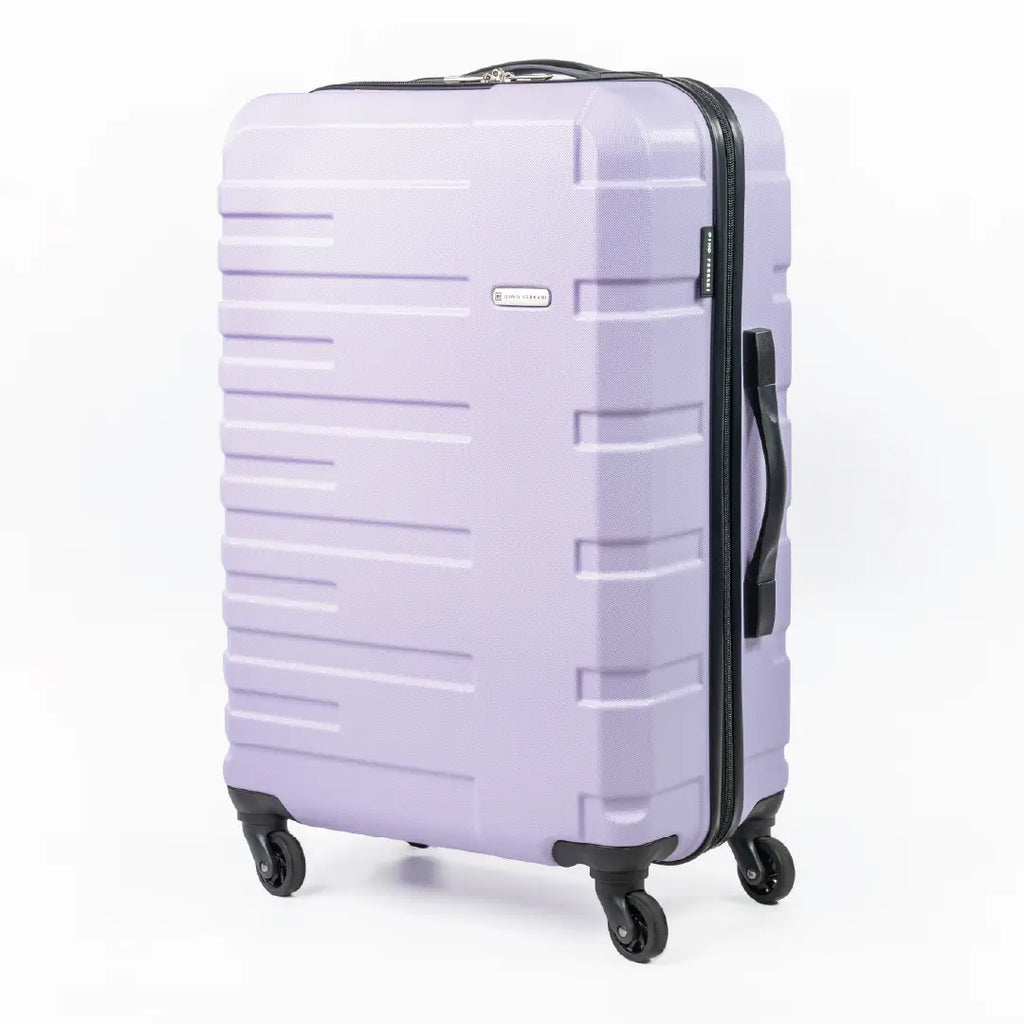 Lavender suitcase with black handle and wheels on a white background