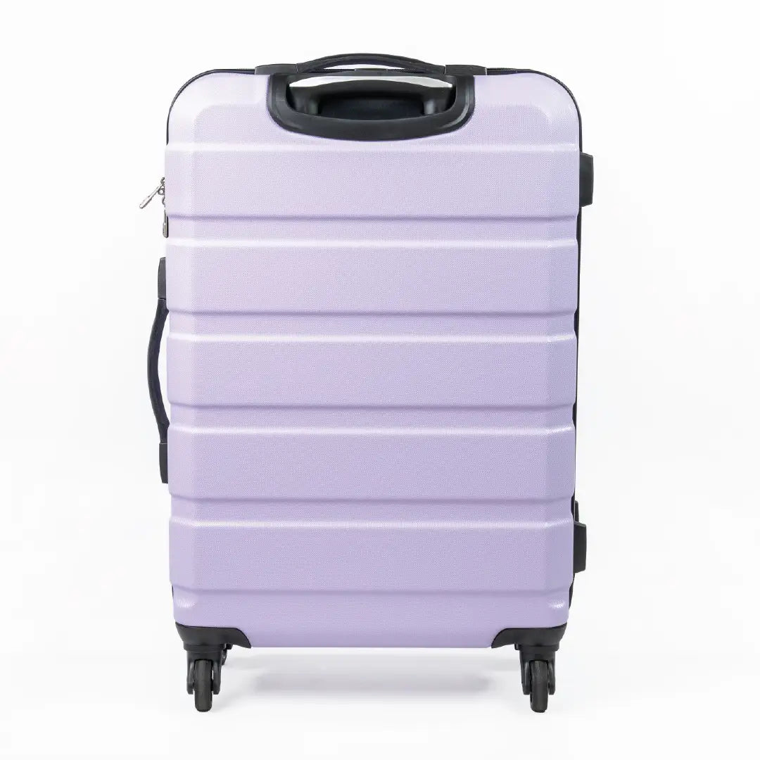 Lavender suitcase with black handle and wheels on a white background
