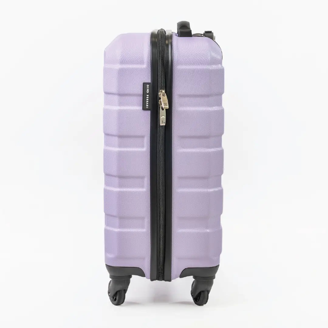 Side view of a purple suitcase showcasing the zipper.