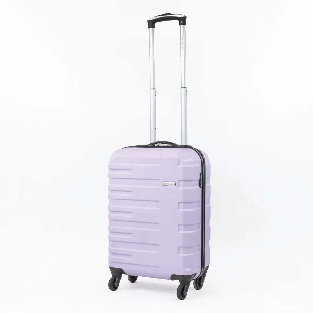 A lavender cabin-sized suitcase with a black handle pulled up and wheels