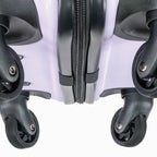 Close-up of the bottom of a suitcase showing the wheels and zipper.