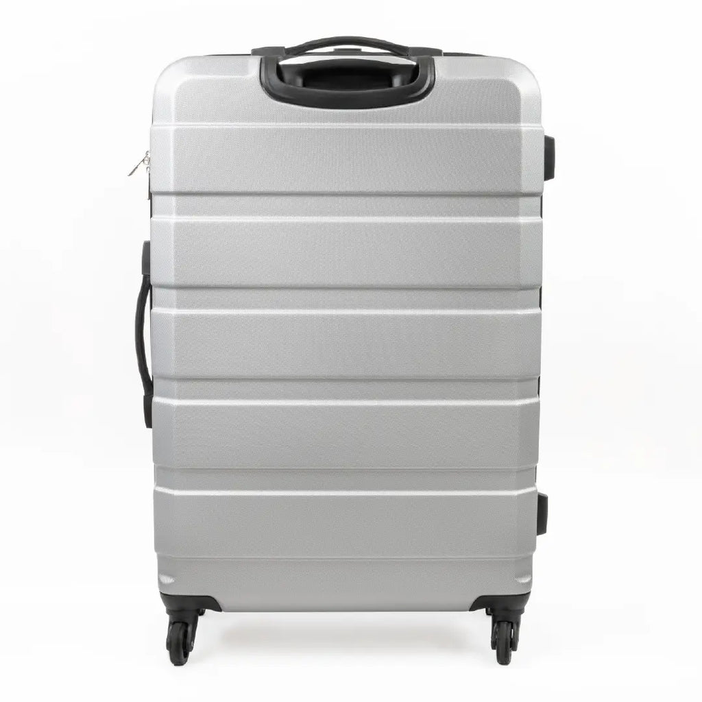 Silver suitcase with black handle on a white background