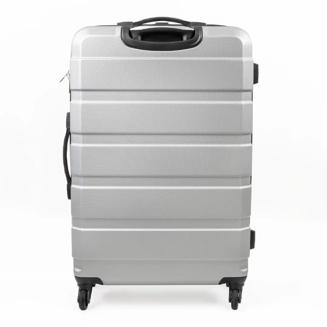 Silver suitcase with black handle on a white background