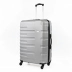 Silver suitcase with black wheels and handle on a white background