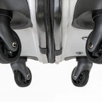 Close-up of a suitcase with wheels on a white background