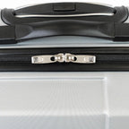 Close-up of a suitcase handle and zipper on a silver suitcase