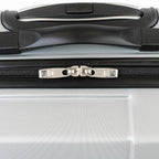 Close-up of a silver suitcase with a black handle and zipper.