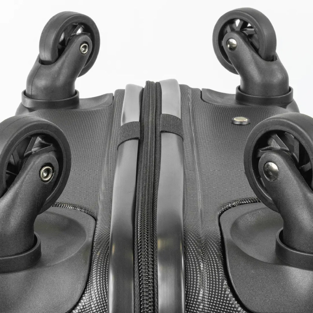 Close-up of a black suitcase with wheels on a white background