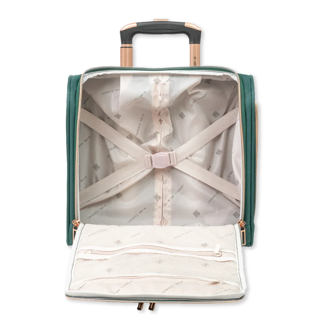 Green suitcase with a white shirt and beige pants inside on a white background
