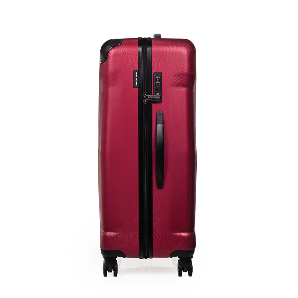 Red suitcase with a black handle on a white background