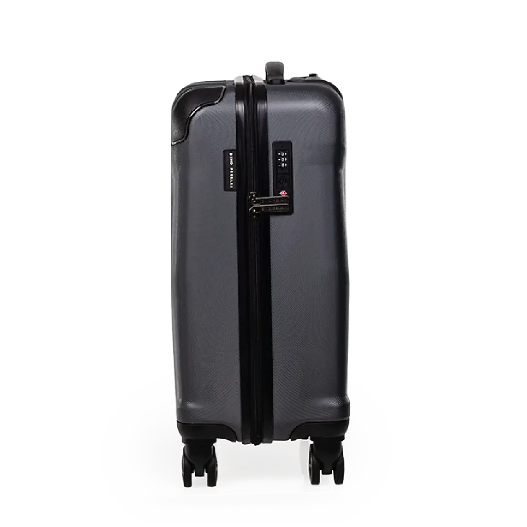 Black suitcase with a visible brand logo on a white background