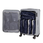 Gray suitcase with open lid showing navy packing cubes and clear compression bag.
