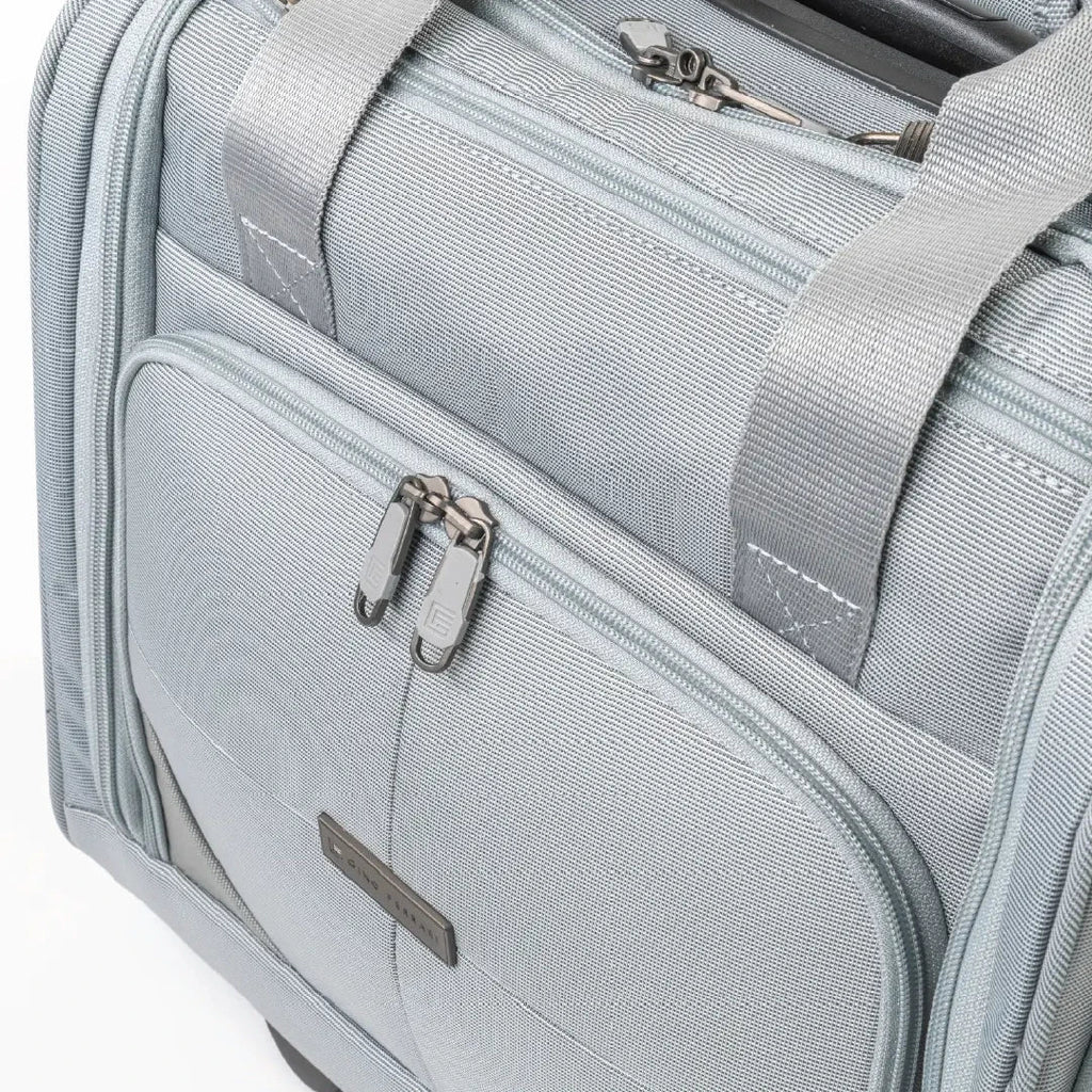 Gray suitcase with zippers and handle on a white background