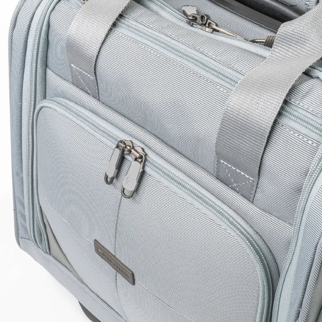 Gray suitcase with zippers and handle on a white background