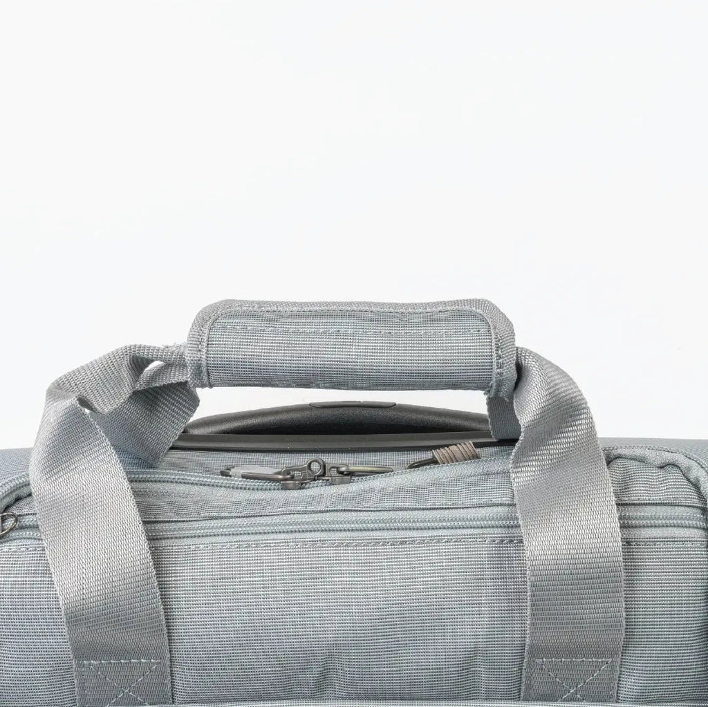 Gray duffel bag with handle on a light gray background