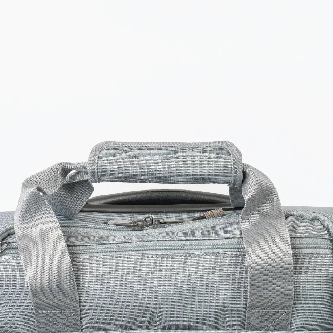 Gray duffel bag with handle on a light gray background