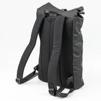 Black roll-top backpack on a white background
