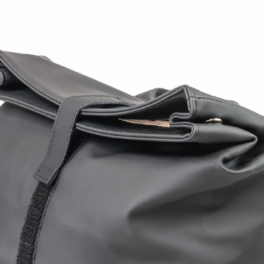 Close-up of a gray bag with a strap on a white background